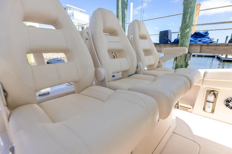 Slide: The Image of Luxurious seating on 2022 Grady-White Canyon 336 boat, docked by the water. - 27