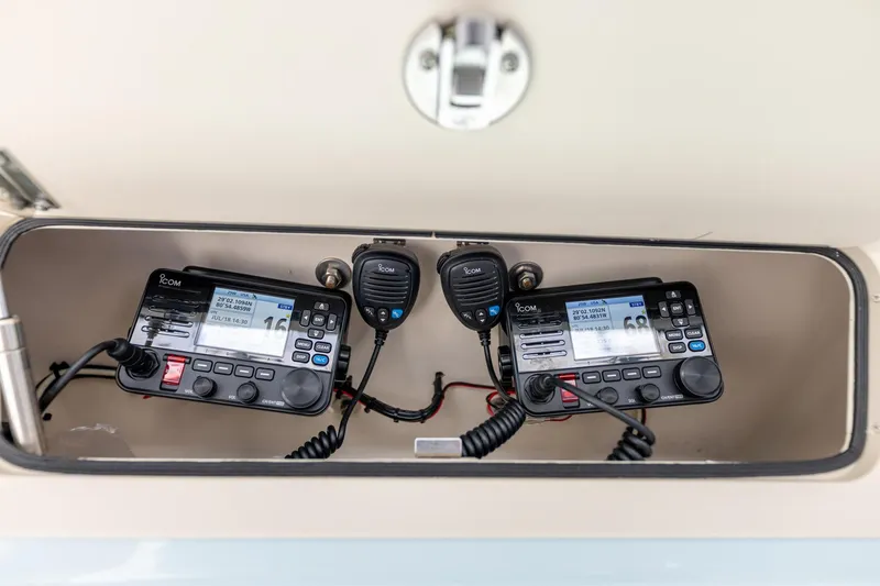 Slide: The Image of 2022 Grady-White Canyon 336 boat with dual Icom marine radios in storage compartment. - 28