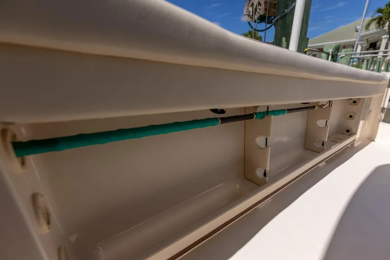 Slide: The Image of 2022 Grady-White Canyon 336 boat interior detail with rod storage. - 33
