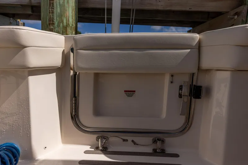 Slide: The Image of 2022 Grady-White Canyon 336 boat interior with cushioned seating and stainless steel fittings. - 41