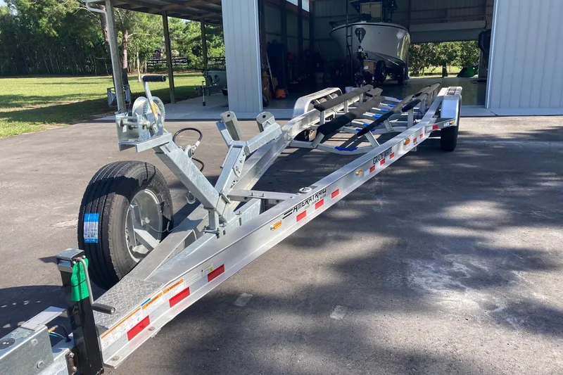 Slide: The Image of Trailer for 2022 Grady-White Canyon 336 boat parked outdoors. - 54