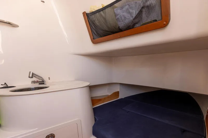 Slide: The Image of 2022 Grady-White Canyon 336 cabin interior with sink and storage. - 6