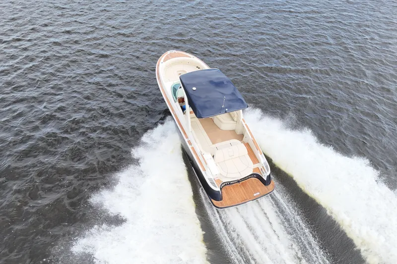 Slide: The Image of 2020 Chris-Craft Launch 31 GT cruising on open water, aerial view. - 10