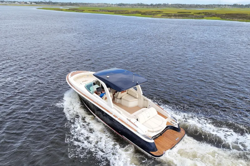 Slide: The Image of 2020 Chris-Craft Launch 31 GT cruising on open water, showcasing luxury design and performance. - 12