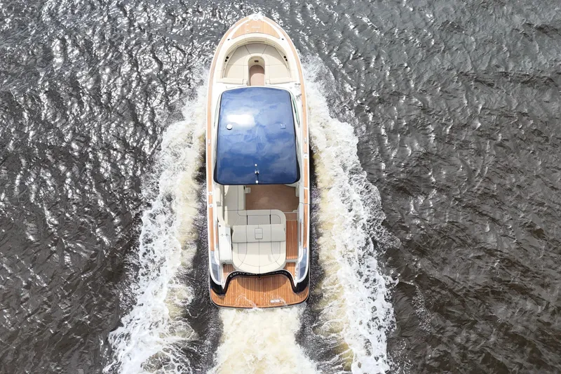 Slide: The Image of Overhead view of 2020 Chris-Craft Launch 31 GT cruising on water. - 24