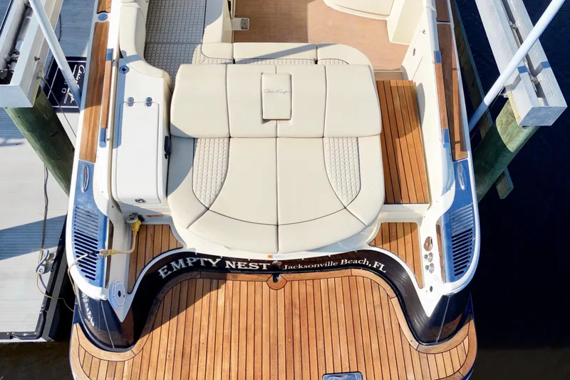 Slide: The Image of 2020 Chris-Craft Launch 31 GT boat with teak deck and cushioned seating, docked at Jacksonville Beach. - 51
