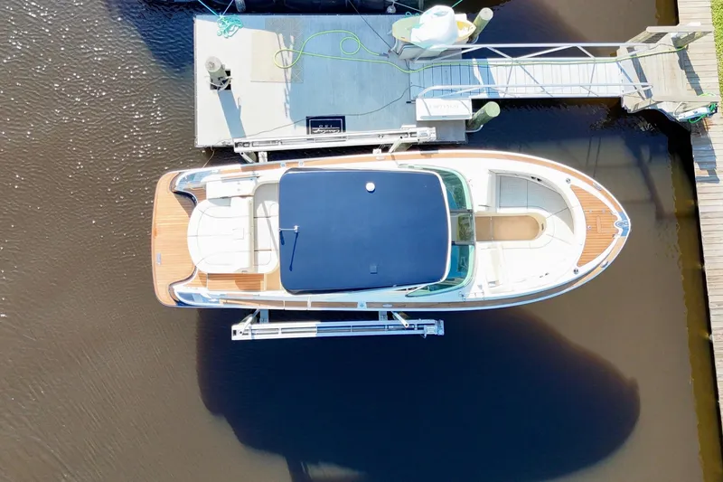 Slide: The Image of Overhead view of 2020 Chris-Craft Launch 31 GT docked at a marina. - 54