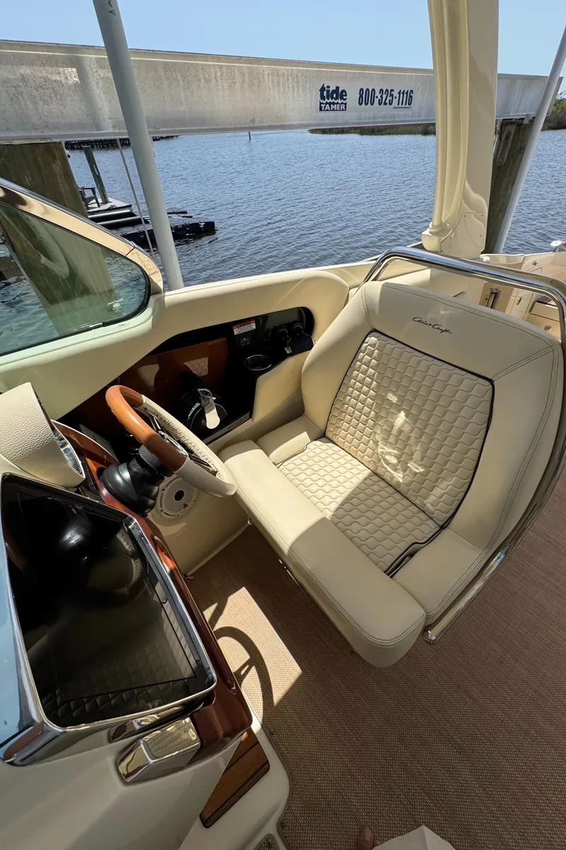 Slide: The Image of 2020 Chris-Craft Launch 31 GT cockpit with luxurious seating and elegant design. - 56