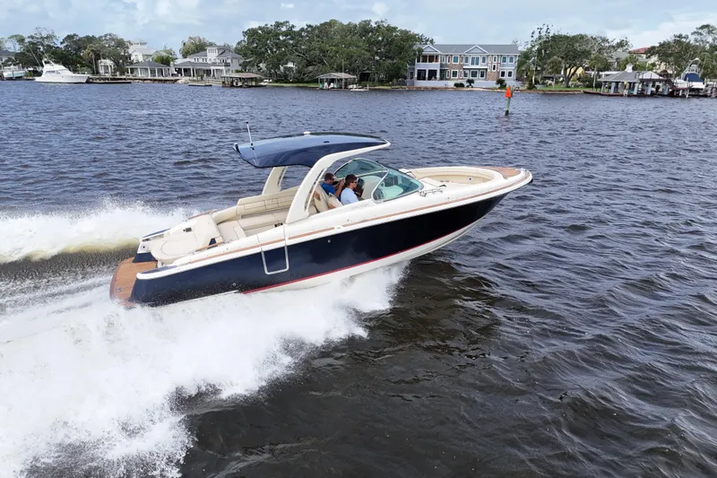 Slide: The Image of 2020 Chris-Craft Launch 31 GT cruising on a scenic waterway. - 6