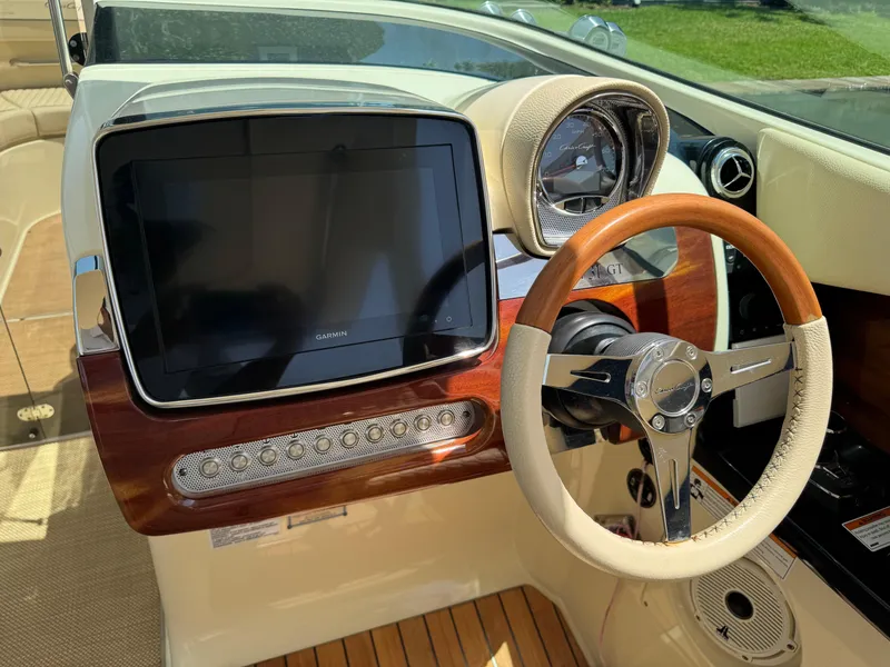 Slide: The Image of 2020 Chris-Craft Launch 31 GT dashboard with modern controls and wooden accents. - 77