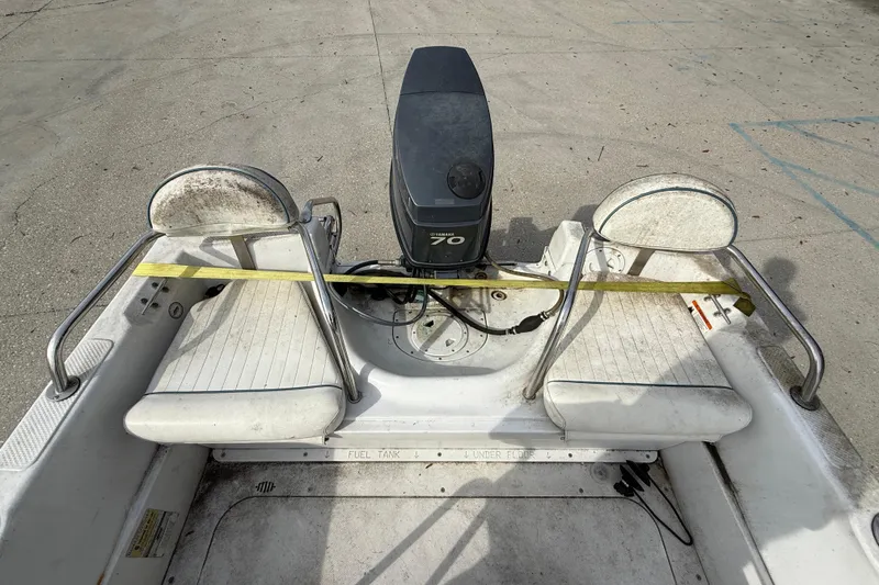 Slide: The Image of 2007 Triumph 170CC boat interior with Yamaha 70 outboard motor, featuring dual seating. - 13