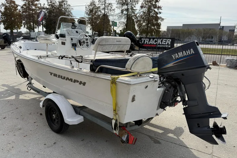Slide: The Image of 2007 Triumph 170CC boat with Yamaha outboard motor on a trailer. - 5
