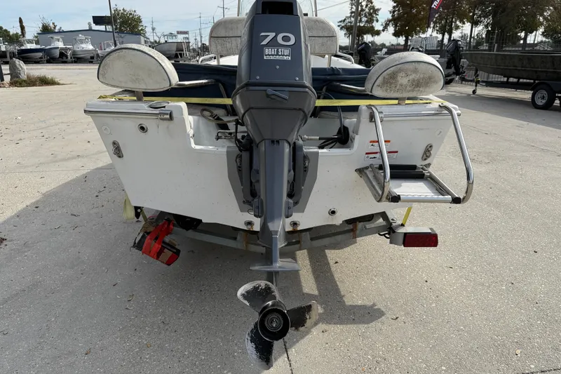 Slide: The Image of Rear view of a 2007 Triumph 170CC boat with an outboard motor. - 6
