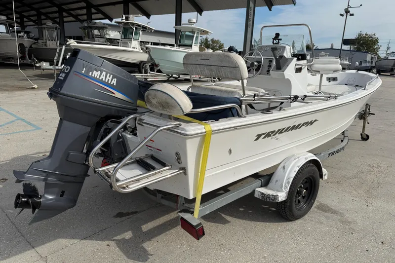 Slide: The Image of 2007 Triumph 170CC boat with Yamaha outboard motor on trailer. - 7