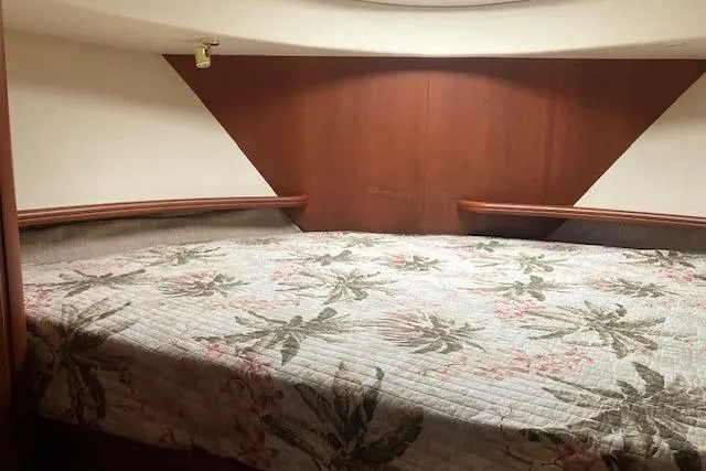 Slide: The Image of Interior cabin of 2006 Silverton 39 Motor Yacht with floral bedding. - 10