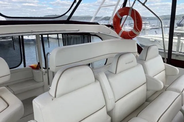 Slide: The Image of 2006 Silverton 39 Motor Yacht interior with white seating and life preserver. - 4