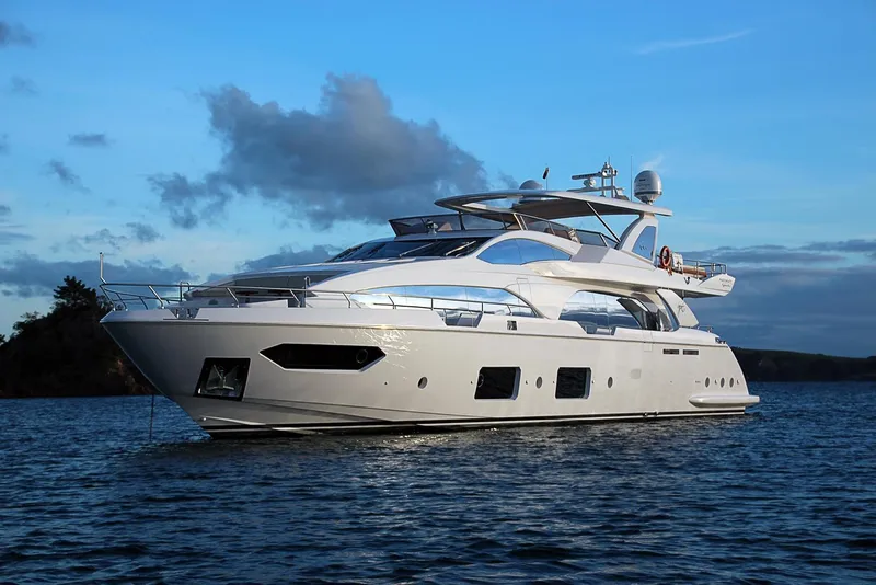 The Image of Luxury 2014 Azimut 100 Grande yacht on serene waters at sunset. - 0