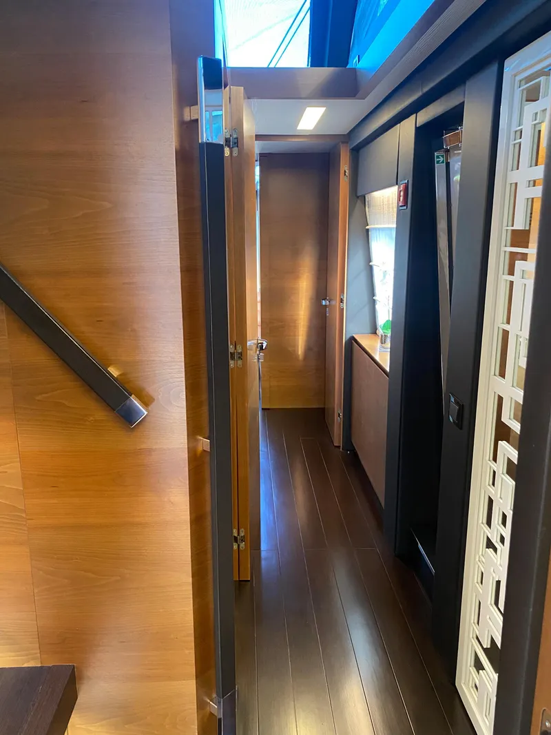 Slide: The Image of Interior hallway of 2014 Azimut 100 Grande yacht with wooden finishes. - 19