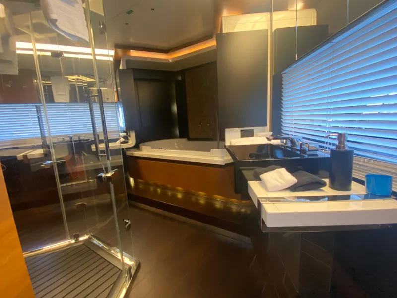 Slide: The Image of Luxurious bathroom on a 2014 Azimut 100 Grande yacht with modern fixtures and a spacious shower. - 23