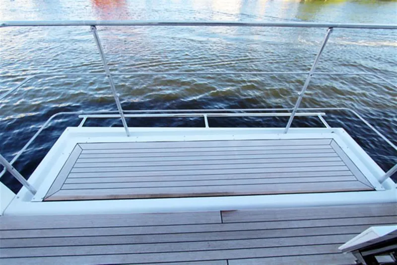 Slide: The Image of Deck of 2014 Azimut 100 Grande yacht overlooking water. - 3