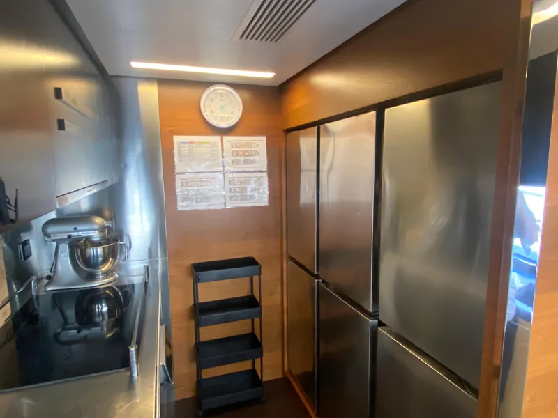 Slide: The Image of Modern kitchen on a 2014 Azimut 100 Grande yacht with stainless steel appliances. - 35