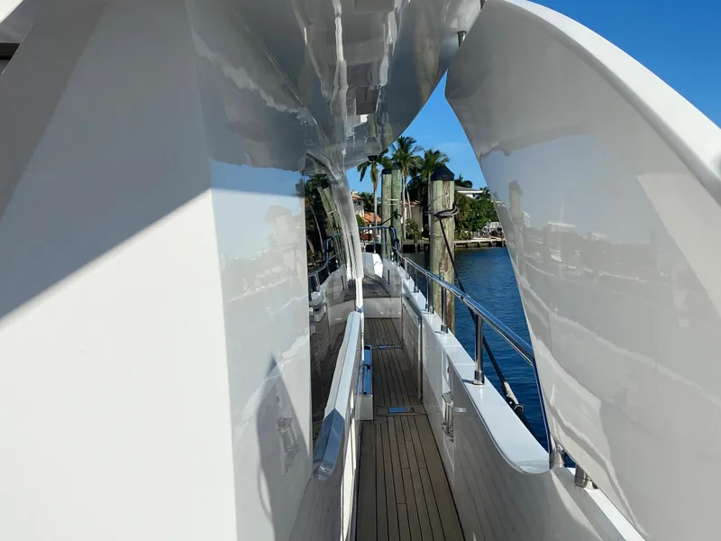 Slide: The Image of Side deck view of 2014 Azimut 100 Grande yacht with sleek white exterior. - 39