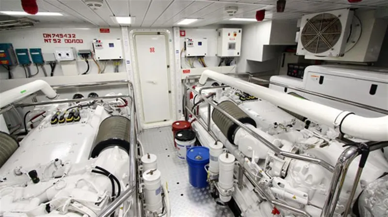 Slide: The Image of Engine room of a 2014 Azimut 100 Grande yacht with twin engines and control panels. - 46