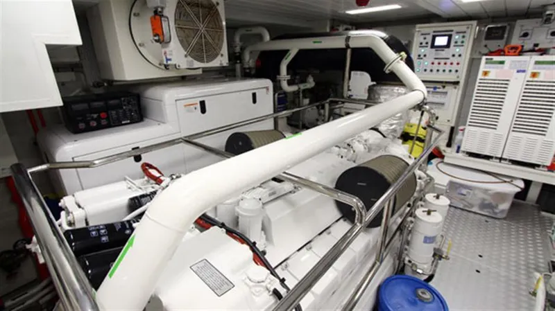 Slide: The Image of Engine room of a 2014 Azimut 100 Grande yacht with machinery and control panels. - 47