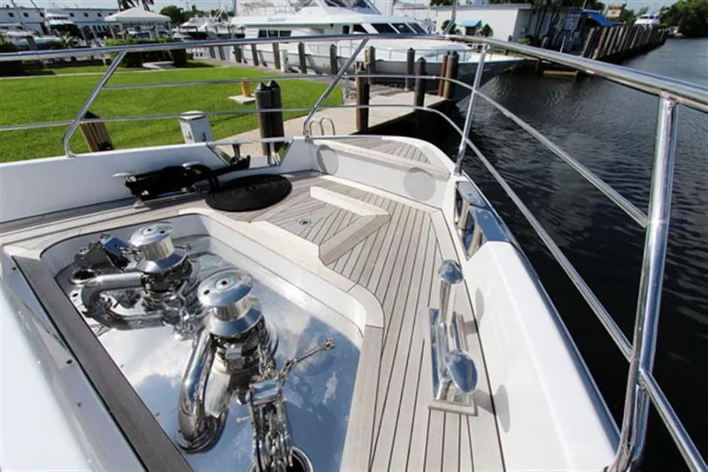 Slide: The Image of 2014 Azimut 100 Grande yacht deck with polished fittings and waterfront view. - 6