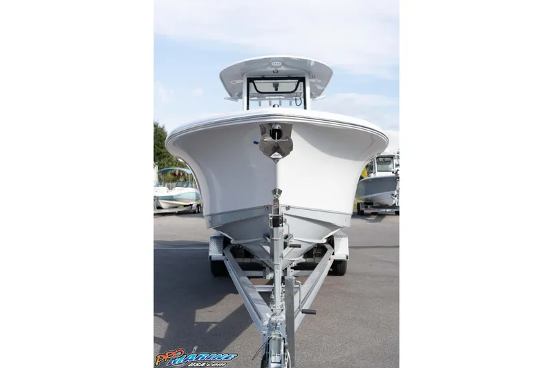 Slide: The Image of 2026 Sea Hunt Gamefish 25 boat on trailer, front view, outdoor display. - 10