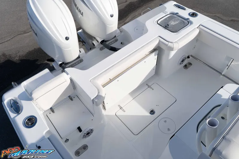 Slide: The Image of 2026 Sea Hunt Gamefish 25 boat deck with Yamaha engines, featuring spacious seating and storage. - 15