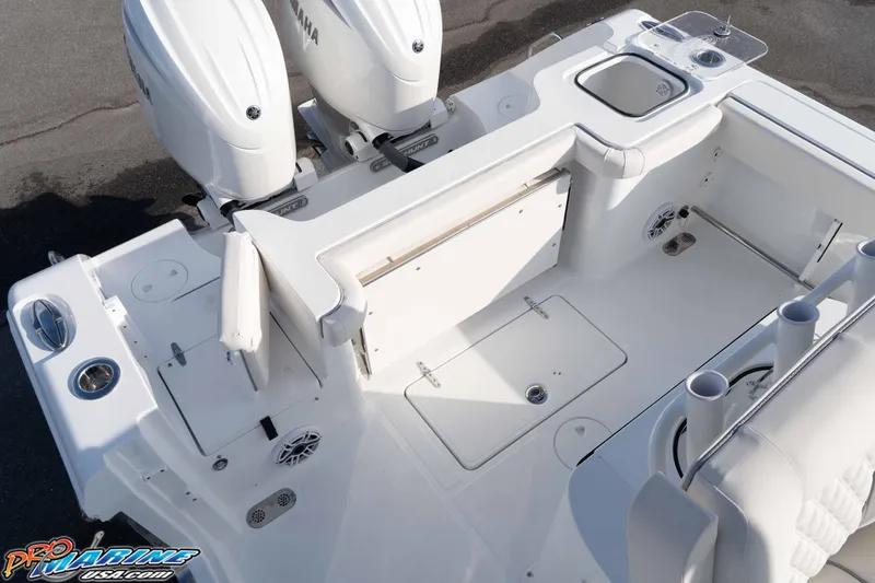 Slide: The Image of 2026 Sea Hunt Gamefish 25 boat deck with Yamaha engines and fishing amenities. - 16