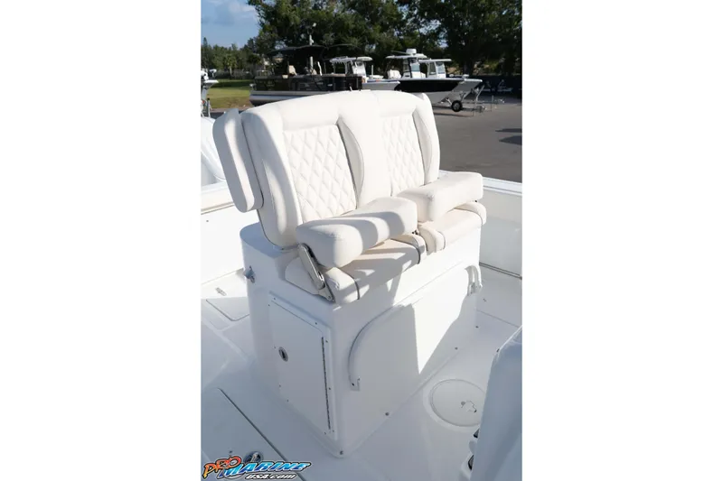 Slide: The Image of 2026 Sea Hunt Gamefish 25 boat with white cushioned seating. - 25