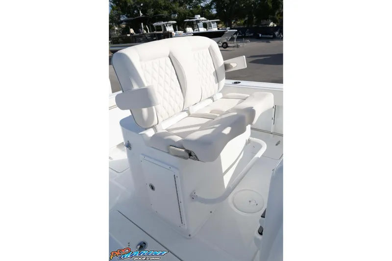 Slide: The Image of 2026 Sea Hunt Gamefish 25 boat seat with white cushioned design. - 27