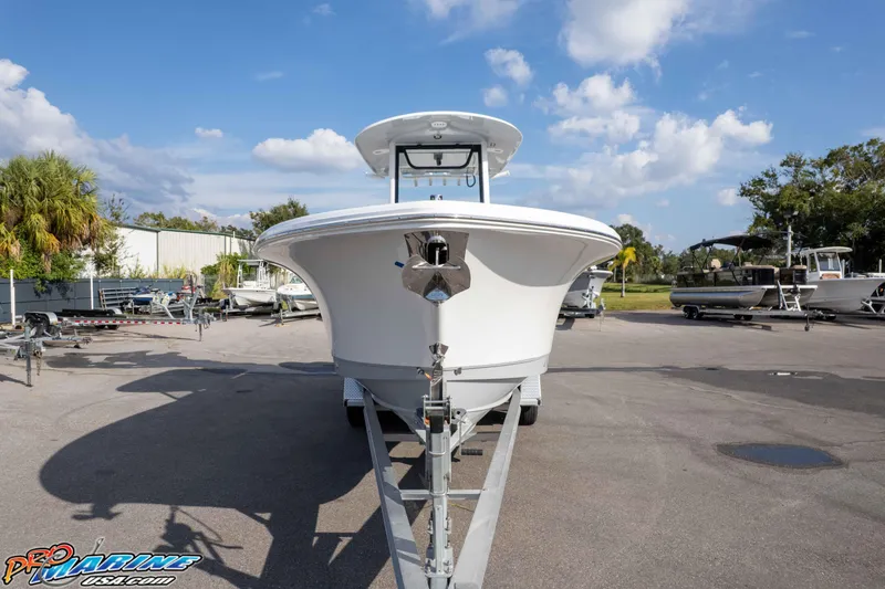 Slide: The Image of 2026 Sea Hunt Gamefish 25 boat on trailer under blue sky. - 37