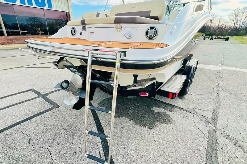 Slide: The Image of 2019 Bryant Potenza boat with ladder and trailer in parking lot. - 10