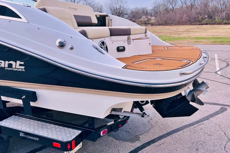 Slide: The Image of 2019 Bryant Potenza boat on trailer, featuring sleek design and wooden deck. - 11