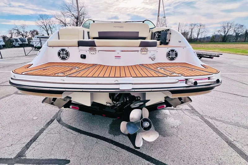 Slide: The Image of 2019 Bryant Potenza boat rear view with teak deck and dual propellers. - 12