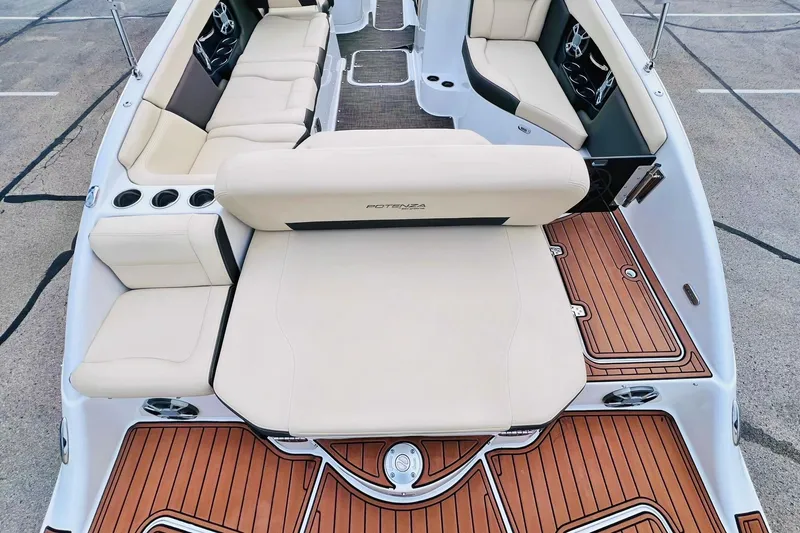 Slide: The Image of 2019 Bryant Potenza boat interior with beige seating and wood flooring. - 13