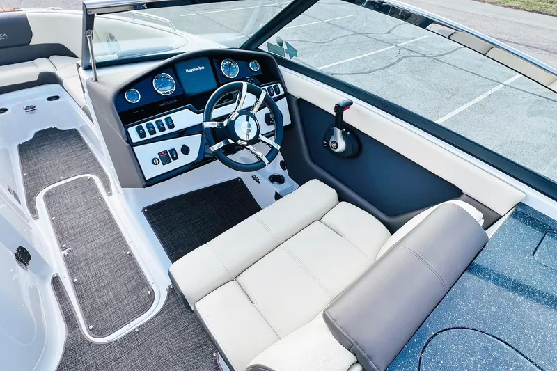 Slide: The Image of 2019 Bryant Potenza boat interior with steering wheel, dashboard, and seating. - 27