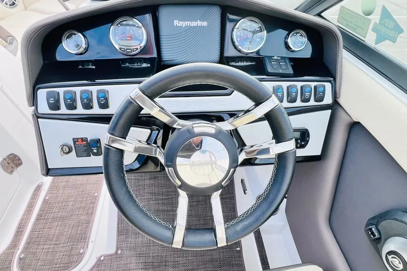 Slide: The Image of 2019 Bryant Potenza boat dashboard with steering wheel and Raymarine navigation system. - 29
