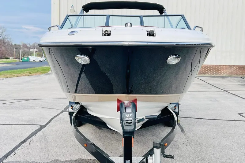 Slide: The Image of 2019 Bryant Potenza boat on trailer, front view, parked outdoors. - 3