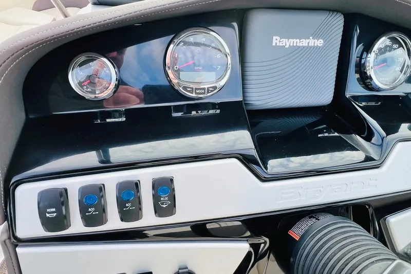 Slide: The Image of Dashboard of a 2019 Bryant Potenza boat with Raymarine display and control switches. - 30