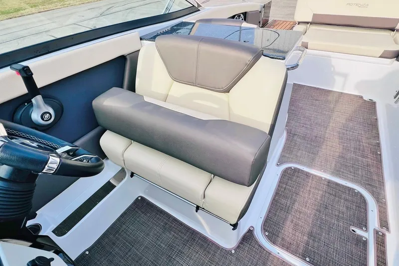 Slide: The Image of 2019 Bryant Potenza boat interior with plush seating and modern steering controls. - 38