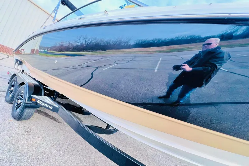 Slide: The Image of 2019 Bryant POTENZA 270 boat with reflective surface in parking lot. - 4