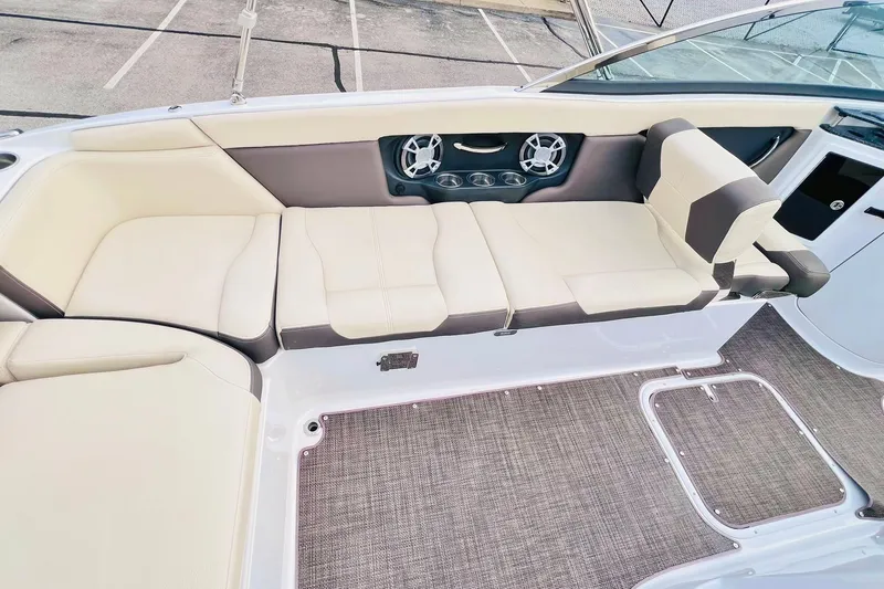 Slide: The Image of 2019 Bryant Potenza boat interior with beige seating and built-in speakers. - 42