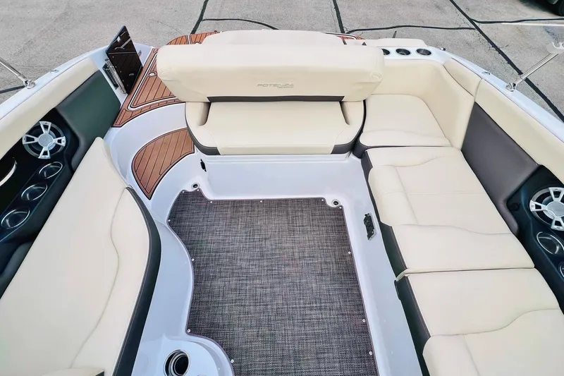 Slide: The Image of 2019 Bryant Potenza boat interior with beige seating and wood accents. - 45