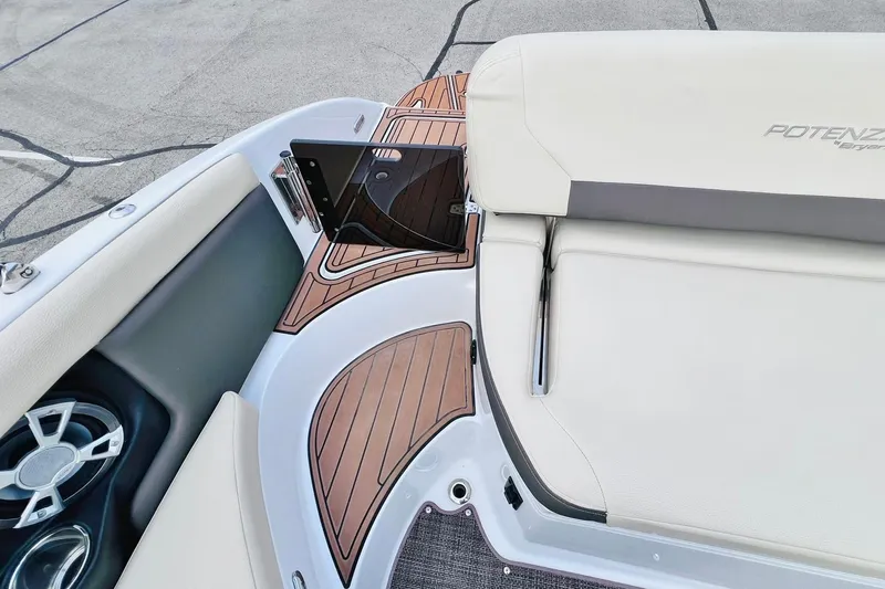 Slide: The Image of 2019 Bryant Potenza boat interior with wood accents and cushioned seating. - 46