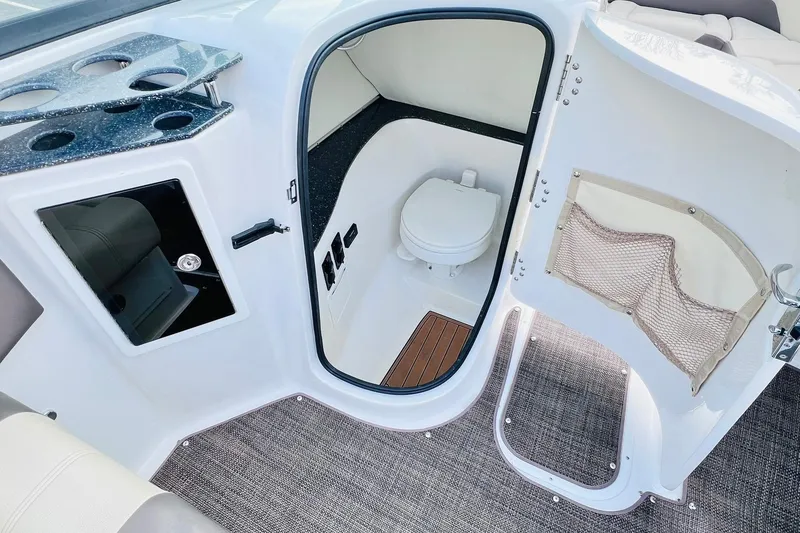 Slide: The Image of 2019 Bryant POTENZA 270 boat interior with toilet and storage compartment. - 48