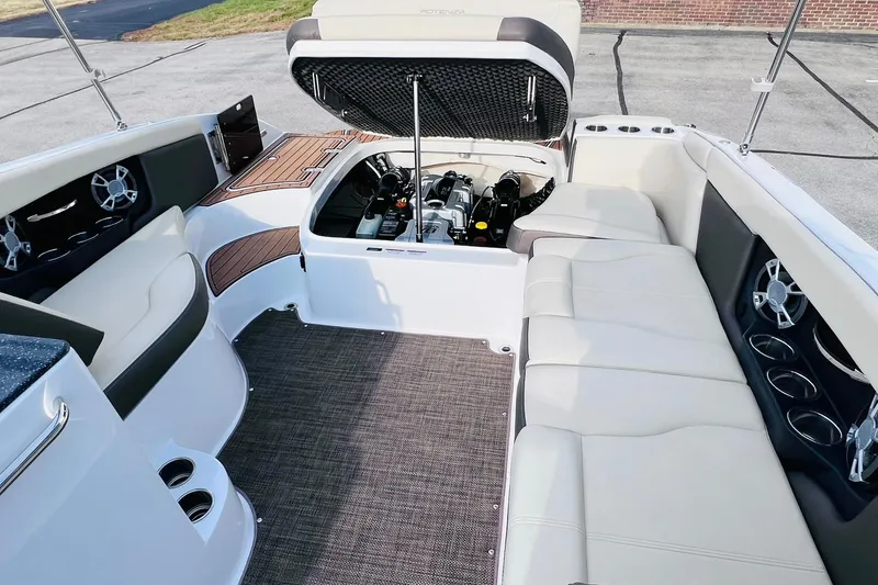 Slide: The Image of 2019 Bryant POTENZA 270 boat interior with open engine compartment and seating area. - 52